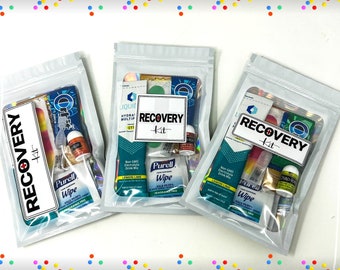 May include: Three clear plastic bags with zipper closures containing various items labeled "Recovery Kit". The bags contain items such as electrolyte drink mix, hand sanitizer, wipes, and lip balm.