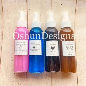 May include: Four glass spray bottles with labels and different colored liquids. The labels include the text "OshunDesigns", "Love & Domination Spell", "Evil Eye Protection & Aura Cleansing", "Black Chicken", "I will Dominate You", "Harlem De Amor y Encantamiento", "Proteccion Contra El Mal De Ojo y Limpieza Del Aura", "Gallina Negra", "Te Dominicare", "PERFUME".