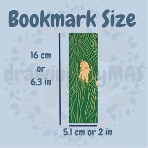 May include: A bookmark with a cat hiding in tall green grass. The bookmark is 6.3 inches tall and 2 inches wide.