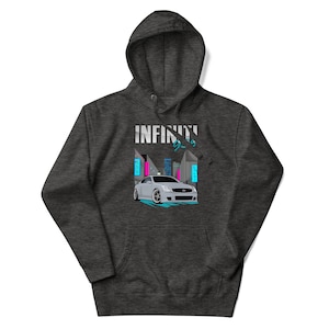 May include: A dark gray hooded sweatshirt with a white car illustration and the text "INFINITY" in a stylized font. The car is set against a backdrop of a city skyline with neon lights.
