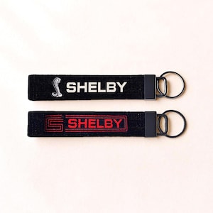 May include: A rustic wooden sign with the text "Welcome to our home" in white lettering. The sign features a distressed finish and a simple, inviting design, perfect for entryway decor.