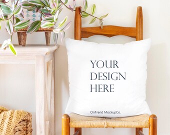 May include: White pillow with the text "YOUR DESIGN HERE" and the words "OnTrend MockupCo." on a wooden chair with a woven seat.
