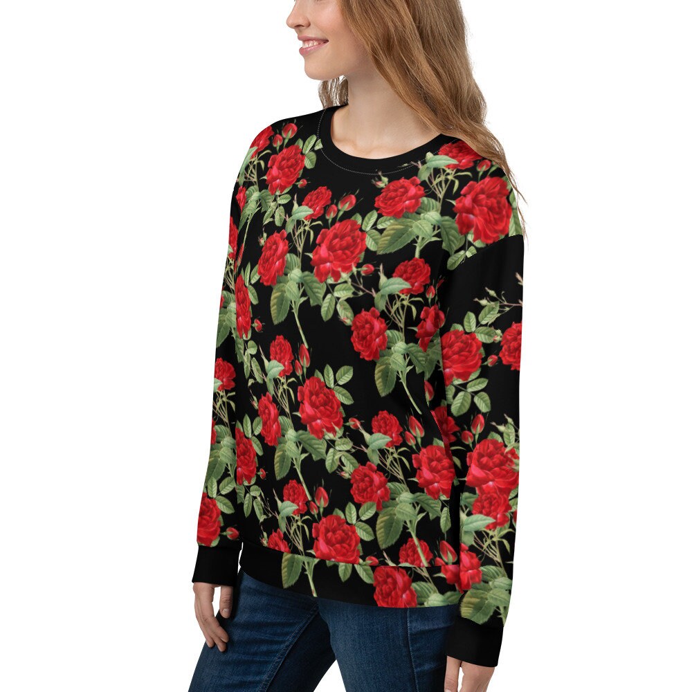 Pull noir avec une rose sale