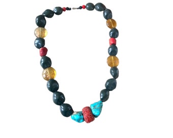 Necklace in wood beads, resins, glass paste and hard stone. North African work ethic
