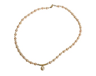 Small Pearl Necklace, 750mm gold clasp centered by a Pear Pearl
