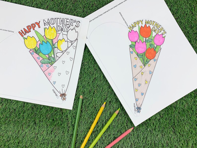 May include: A printable Mother's Day card with a bouquet of flowers. The card is designed to be folded into a cone shape. The flowers are colored in yellow, blue, pink, and red. The text on the card reads "Happy Mother's Day".