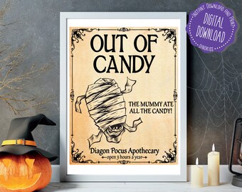 May include: A printable sign with a vintage aesthetic featuring a mummy with the text "Out of Candy" and "The Mummy Ate All The Candy!"  The sign also includes the text "Diagon Pocus Apothecary - open 3 hours a year -"