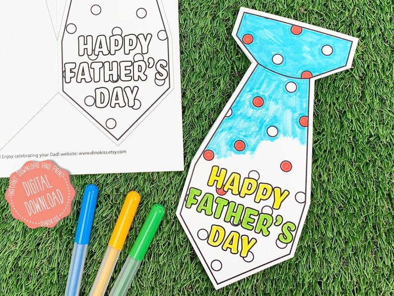 May include: A printable Father's Day card shaped like a tie. The tie is blue with white and red polka dots. The card says "Happy Father's Day" in yellow and green letters.