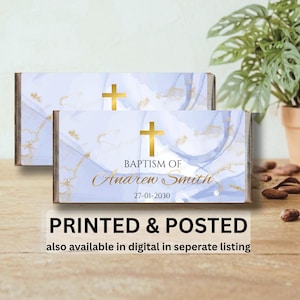 May include: Two rectangular boxes with a light blue and gold design, featuring a gold cross and the text "BAPTISM OF Anaren Smith 27-01-2030". The boxes have the text "PRINTED & POSTED" and "also available in digital in seperate listing".