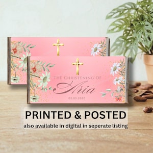 May include: Two pink candy bar wrappers with gold crosses and floral designs. The text reads "THE CHRISTENING OF Aria 02.03.2030". The bottom of the image has the text "PRINTED & POSTED" and "also available in digital in seperate listing".
