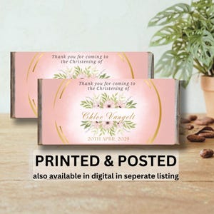 May include: Two pink Christening favours with gold detailing and floral arrangements. The text reads "Thank you for coming to the Christening of Chloe Vangeli 20th April 2029." The bottom of the image says "PRINTED & POSTED".