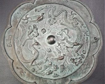 Dragon  mirror A Fine eight lobed copper bronze mirror 铜镜  from the Sui - Tang dynasty (613) Ancient metal silver Chinese antiues