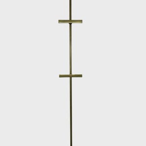 May include: A tall, bronze-colored display stand with a square base and a vertical pole. Two horizontal bars extend from the pole, creating a T-shape. The stand is designed to hold items for display, such as artwork or signage.