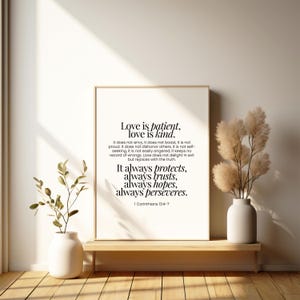 May include: A black and white printable wall art print with a quote from the Bible, 1 Corinthians 13:4-7, about love being patient, kind, protective, trusting, hopeful, and persevering.