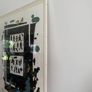 May include: A framed black and white print with a geometric design featuring silhouettes of people and trees. The print is set against a white background and has a white mat.