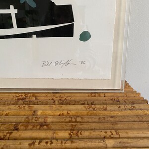 May include: A black and white print of a stylized image of people and a boat. The print is signed "Bill Selin" and dated "1966".