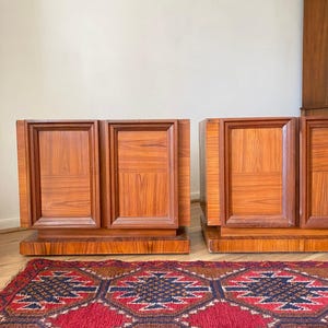 A pair of Mid Century Modern Two Door Sculpted Nightstands With Drawers