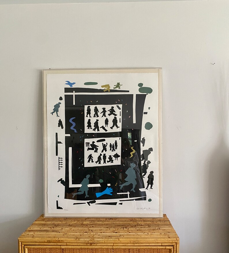 May include: A black and white print of a busy city scene with people walking in a maze-like pattern. The print is framed in a white frame and has a white mat.