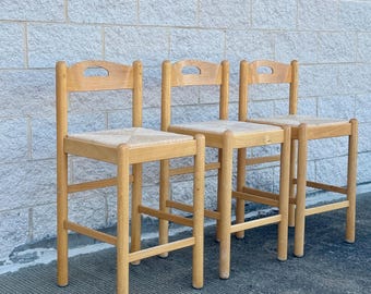 A Set of Three Vintage Rush Seat Stools