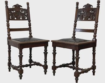 Antique Spanish Revival Carved Oak Chairs – Pair with Leather Seats