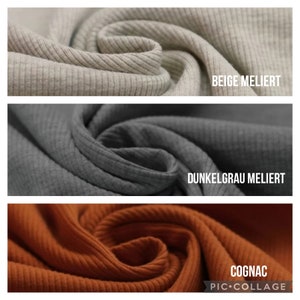 May include: Close-up of three fabric swatches in beige, dark gray, and orange. The fabric is ribbed and has a subtle texture. The swatches are labeled "Beige Melliert", "Dunkelgrau Melliert", and "Cognac".