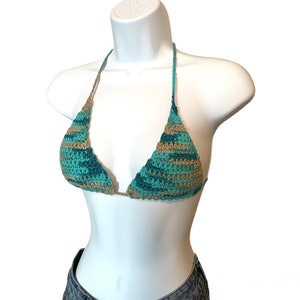 May include: A crocheted bikini top in a teal and brown color pattern. The top is a triangle style with adjustable straps.