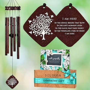 May include: A bronze-colored wind chime with multiple metal tubes and a square wooden wind catcher featuring a white tree and bird design. Includes a card with white floral borders and the text "with sympathy" and a brown gift box with a teal ribbon.