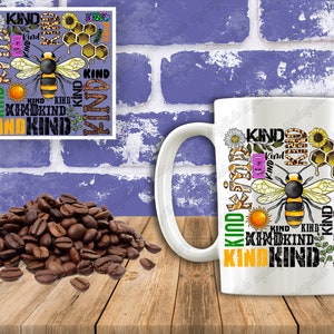 May include: White ceramic mug with a colorful design featuring a bee, honeycomb, flowers, and the word "KIND" repeated multiple times.