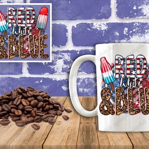 May include: White ceramic mug with a red, white and blue design featuring popsicles and the text "Red White & Blue" with a leopard print background.