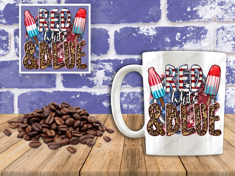 May include: White ceramic mug with a red, white and blue design featuring popsicles and the text "Red White & Blue" with a leopard print background.