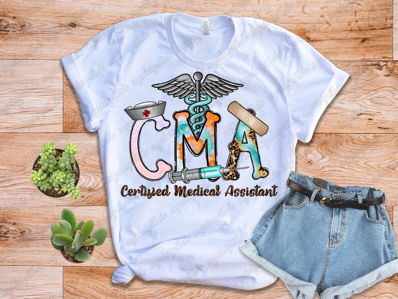 May include: White t-shirt with a colorful graphic design that says "CMA Certified Medical Assistant". The graphic includes a medical symbol, a bandage, a stethoscope, and a syringe.
