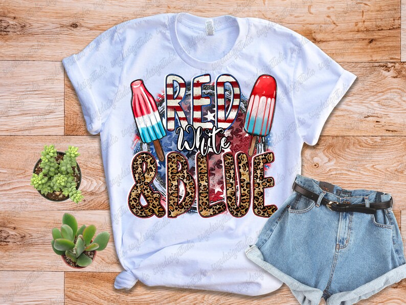 May include: White t-shirt with a red, white and blue graphic design featuring popsicles and the text "Red White & Blue" with a leopard print background.