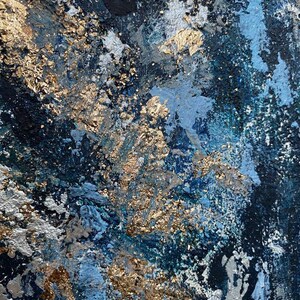 May include: Abstract painting with a textured surface. The painting features shades of blue, silver, and gold.