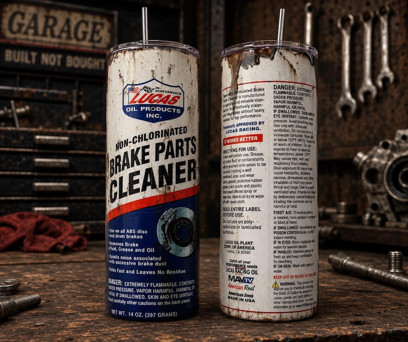 May include: A cylindrical tumbler featuring a distressed, weathered design that mimics a can of Lucas Oil Non-Chlorinated Brake Parts Cleaner. The white, red, and blue label includes technical text, a brake rotor graphic, and a clear lid with a straw.