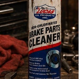 May include: A cylindrical tumbler featuring a graphic design that mimics a can of Lucas Oil Products Non-Chlorinated Brake Parts Cleaner. The design includes white, red, and blue colors, text, a brake rotor illustration, and a metal straw.