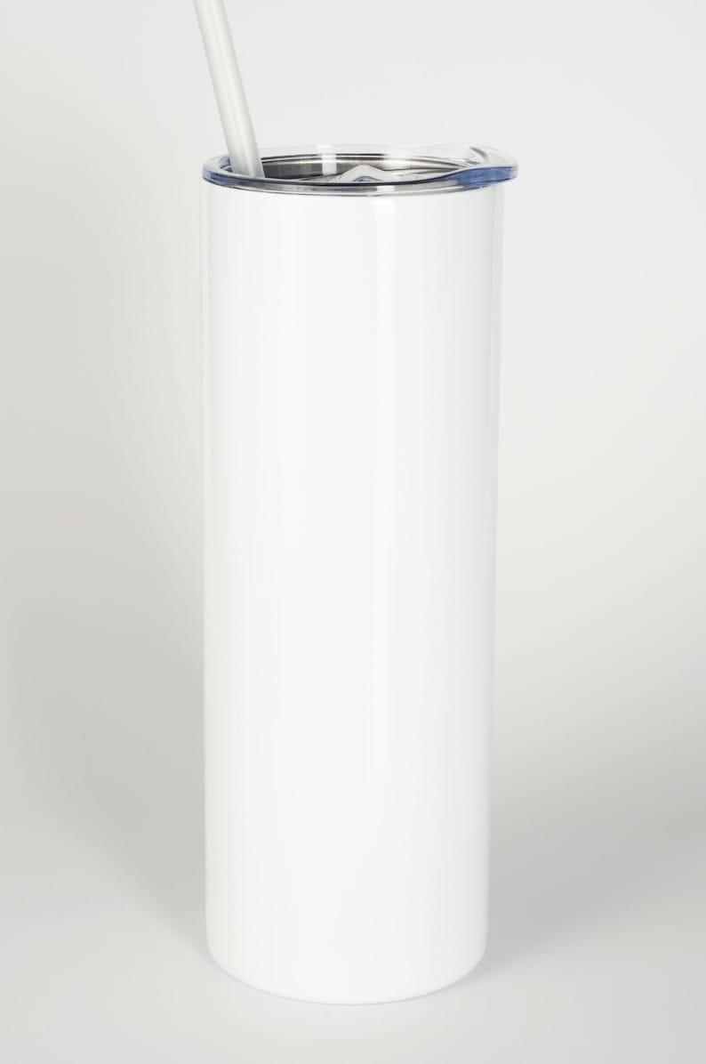 May include: A tall, cylindrical white tumbler with a smooth, solid finish. The container features a clear, removable plastic lid with a small opening and a matching white straw inserted through the top, providing a clean and simple design.