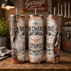 May include: A cylindrical metal tumbler with a straw, featuring a distressed, rusted metal texture and a graphic design that reads, I'M A MECHANIC I CAN'T FIX STUPID BUT I CAN FIX WHAT STUPID DOES, accompanied by illustrations of crossed engine pistons.