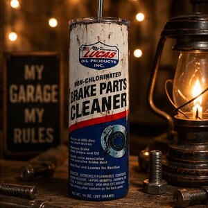 May include: A cylindrical tumbler featuring a distressed white, red, and blue graphic design mimicking a Lucas Oil Non-Chlorinated Brake Parts Cleaner can. The design includes the brand logo, text, a brake disc illustration, and a metal straw.