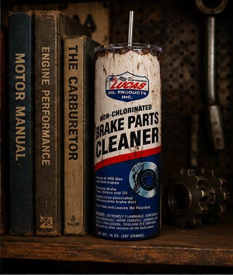 May include: A cylindrical tumbler featuring a distressed, weathered design mimicking a Lucas Oil Products Non-Chlorinated Brake Parts Cleaner can. The white, red, and blue label includes the Lucas logo, text, and a brake disc graphic with a metal straw.