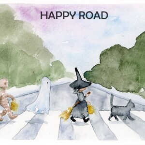 May include: A watercolor painting of a crosswalk with a mummy, a ghost, a witch riding a broom, and a black cat. The text "HAPPY ROAD" is written at the top of the image.