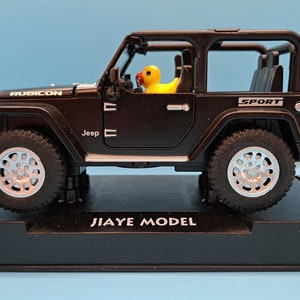 Duck driven die cast toy jeep -(disclaimer) not associated with the Jeep corporation nor it&#39;s affiliates.