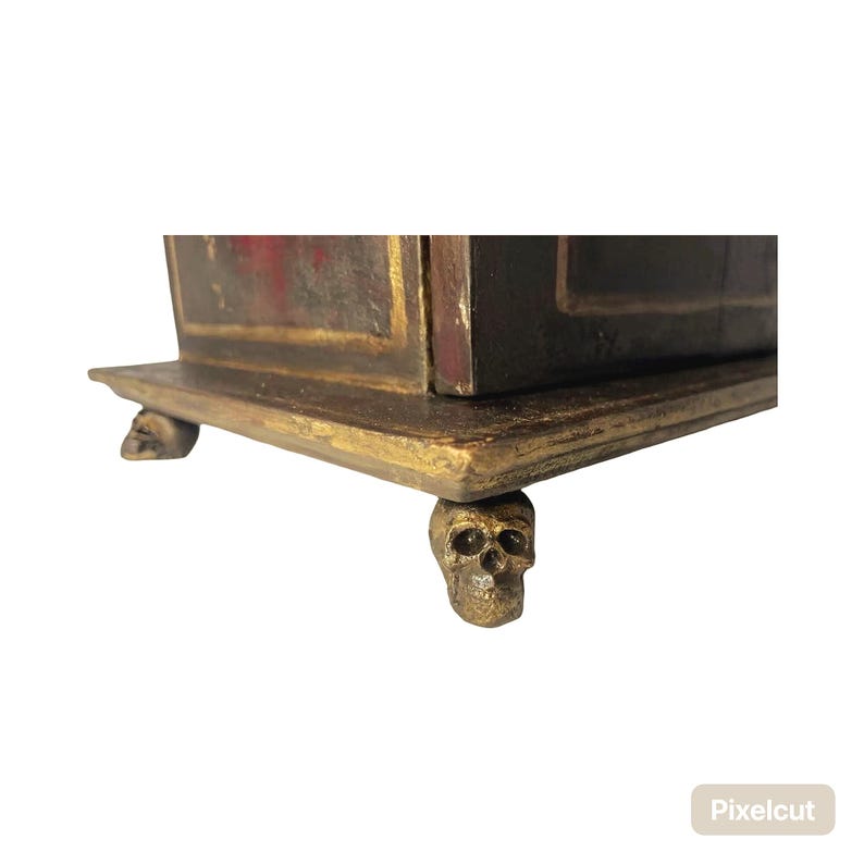 skull feet hold up ancestral Memorial