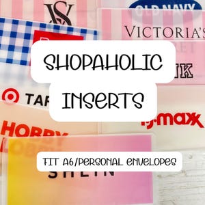 May include: A collection of clear plastic inserts for A6/personal envelopes, featuring various brand logos like Victoria's Secret, Old Navy, and Target. The text "SHOPAHOLIC INSERTS" is prominently displayed.