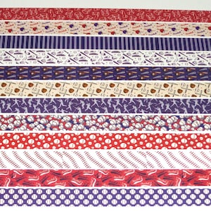 May include: Ten different patterned washi tapes with a baseball theme. The patterns include baseballs, bats, gloves, and players. The tapes are all in shades of red, white, and blue.