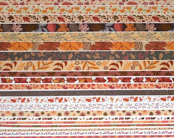 May include: A set of 12 washi tapes featuring autumnal designs. The tapes feature various patterns including leaves, pumpkins, and the text "Hello Autumn".