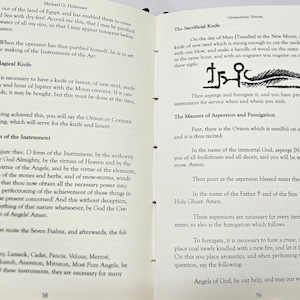 May include: A page from a book about the magical knife, a ritualistic knife used in ancient magic. The page includes instructions on how to make the knife, the day and hour it should be made, and the incantations to be used. The page also includes a drawing of the knife and its sigils.