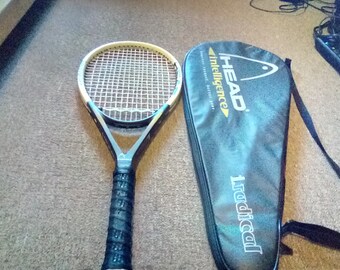 Head intelligence tennis racket used like new and accessaries.