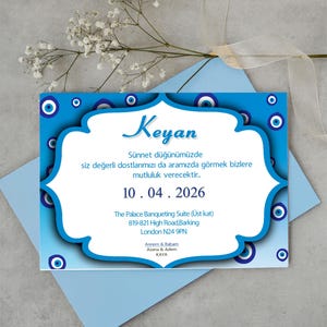 May include: A blue and white invitation with a white border and a blue background. The invitation is decorated with blue evil eye charms. The text on the invitation reads "Keyan" and includes the date "10.04.2026", the location "The Palace Banqueting Suite (Upper floor)", the address "819-821 High Road, Barking, London N24 9PN", and the names "Annem & Babam, Asena & Adem, KAYA".