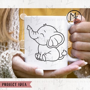 May include: A white ceramic mug with a black line drawing of a cartoon elephant with its trunk raised. The elephant is sitting on its hind legs and has a happy expression.