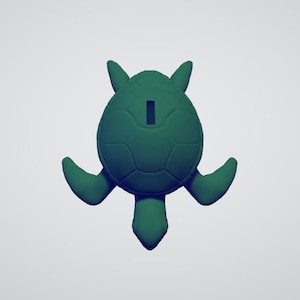 May include: A green ceramic turtle figurine with a hole in the back. The turtle is facing down with its legs outstretched.
